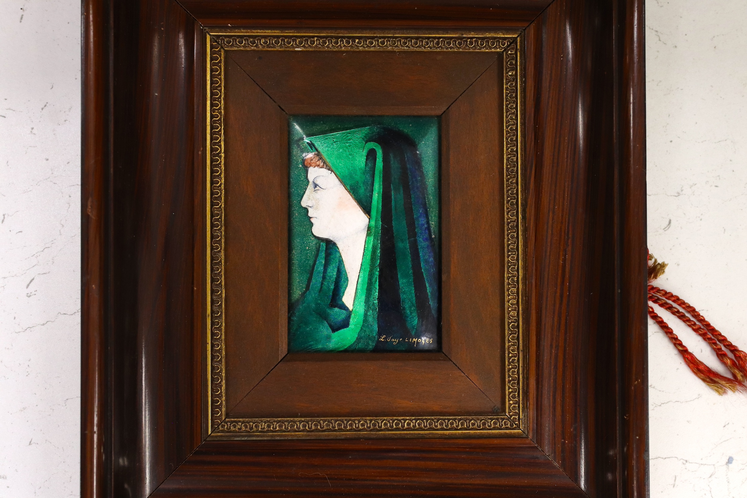 A framed Limoges plaque, signed L. Faye Limoges, frame 29cm high, 25cm wide. Condition - fair to good